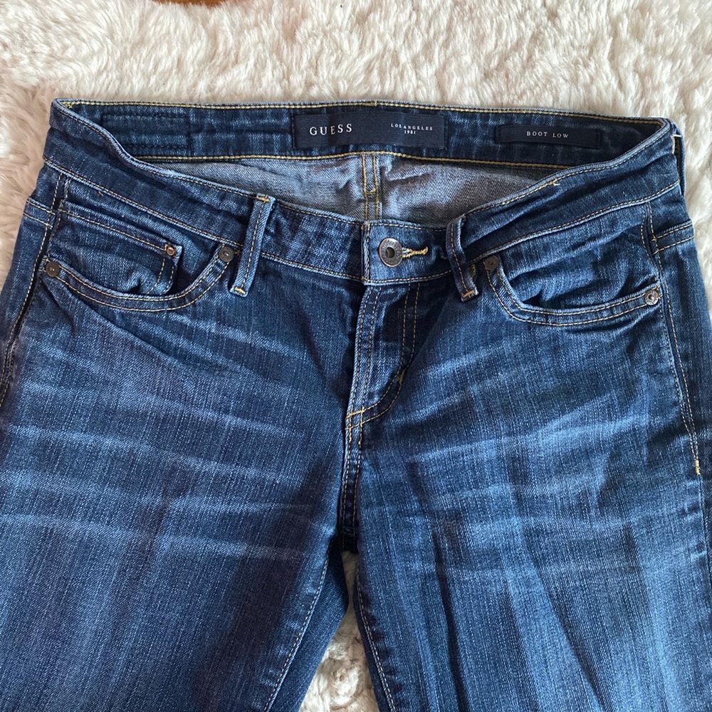 Guess dark wash boot low jeans (no distressing, slightly flare at the bottom)